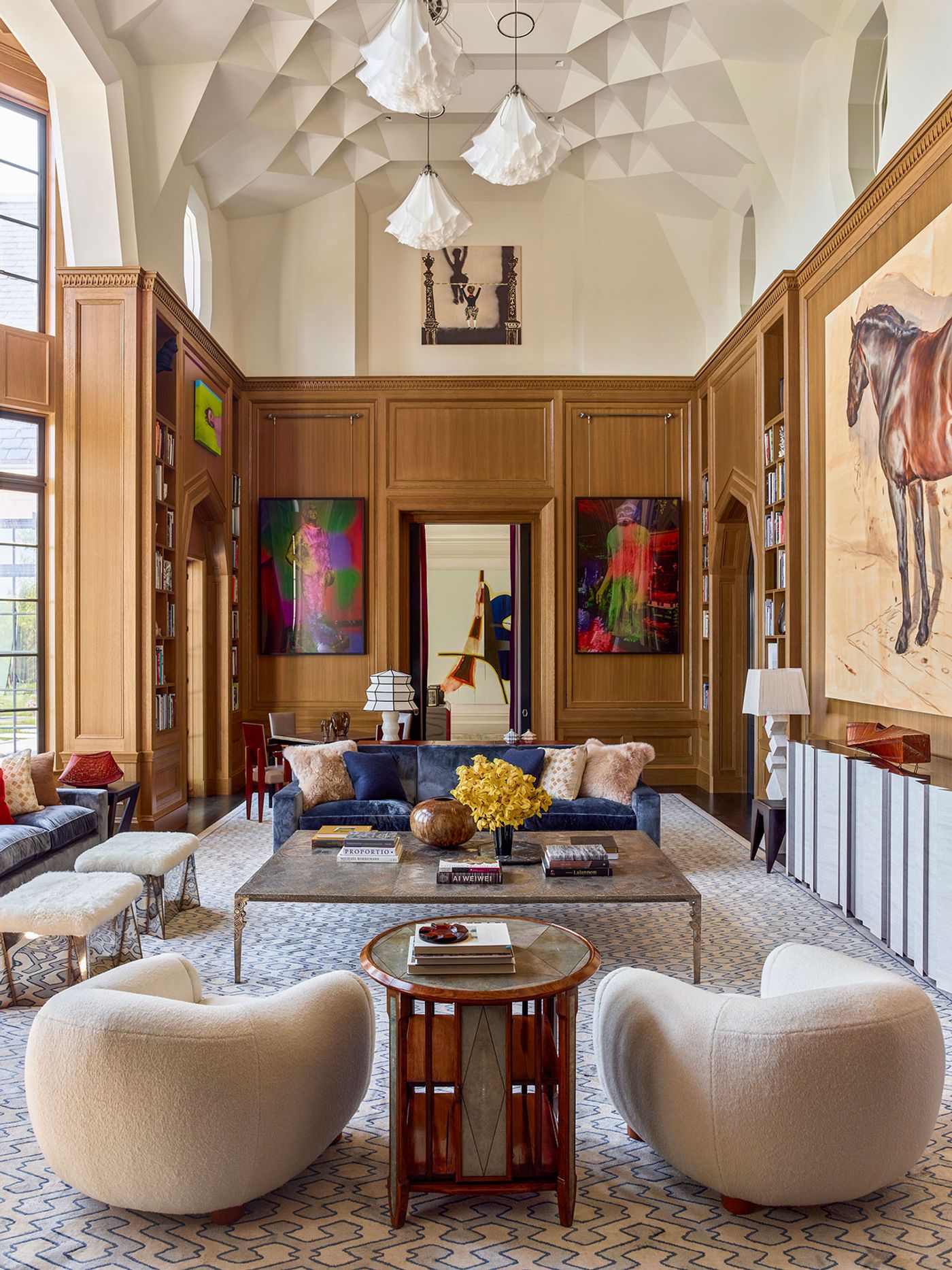 Living room: Flanking the door are two Cibachrome prints by Mike Kelley, John Glenn and Bigfoot (2001). In the niche above is Mamma Andersson’s Hangman (2014). In the foreground, a rosewood, shagreen, and ebony table-bibliothèque tournante (ca. 1920) by Clément Rousseau is flanked by a pair of Jean Royère's Polar Bear chairs fabricated by August Studios.
Photography by Eric Piasecki. Living room: Flanking the door are two Cibachrome prints by Mike Kelley, John Glenn and Bigfoot (2001). In the niche above is Mamma Andersson’s Hangman (2014). In the foreground, a rosewood, shagreen, and ebony table-bibliothèque tournante (ca. 1920) by Clément Rousseau is flanked by a pair of Jean Royère's Polar Bear chairs fabricated by August Studios.
Photography by Eric Piasecki.