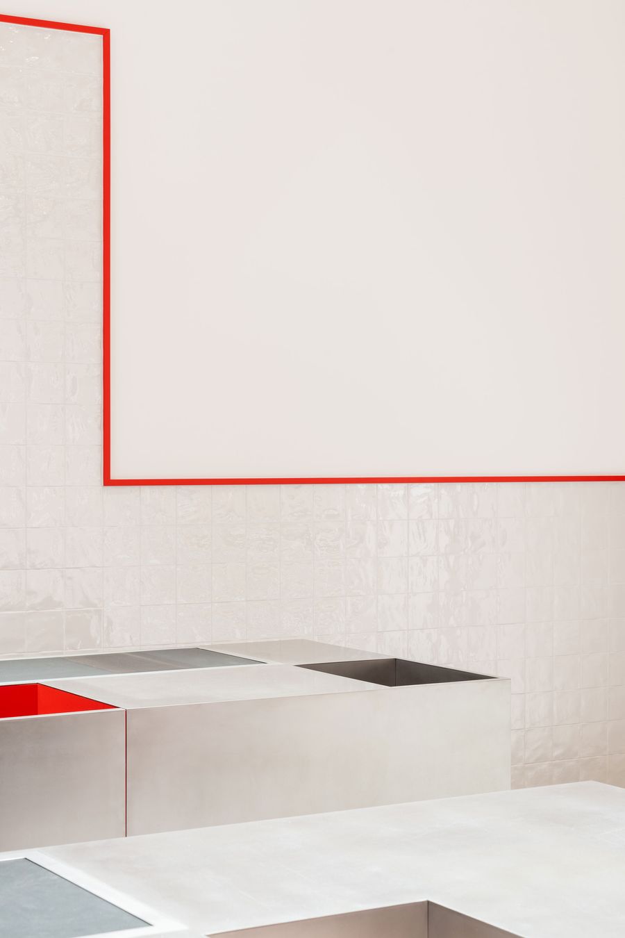 Minimalist white surfaces meet precise red linear details in this study of geometric reduction. The clean intersection of planes and the strategic use of color as wayfinding create spatial clarity while maintaining visual interest through proportional relationships and material transitions. Minimalist white surfaces meet precise red linear details in this study of geometric reduction. The clean intersection of planes and the strategic use of color as wayfinding create spatial clarity while maintaining visual interest through proportional relationships and material transitions.