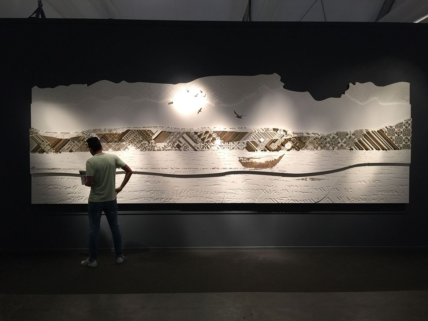 The massive Corian mural with inlaid brass elements at the booth of Naqsh Collective at Design Days Dubai 2016. Photo by Kiriakos Spirou for Yatzer.com.
