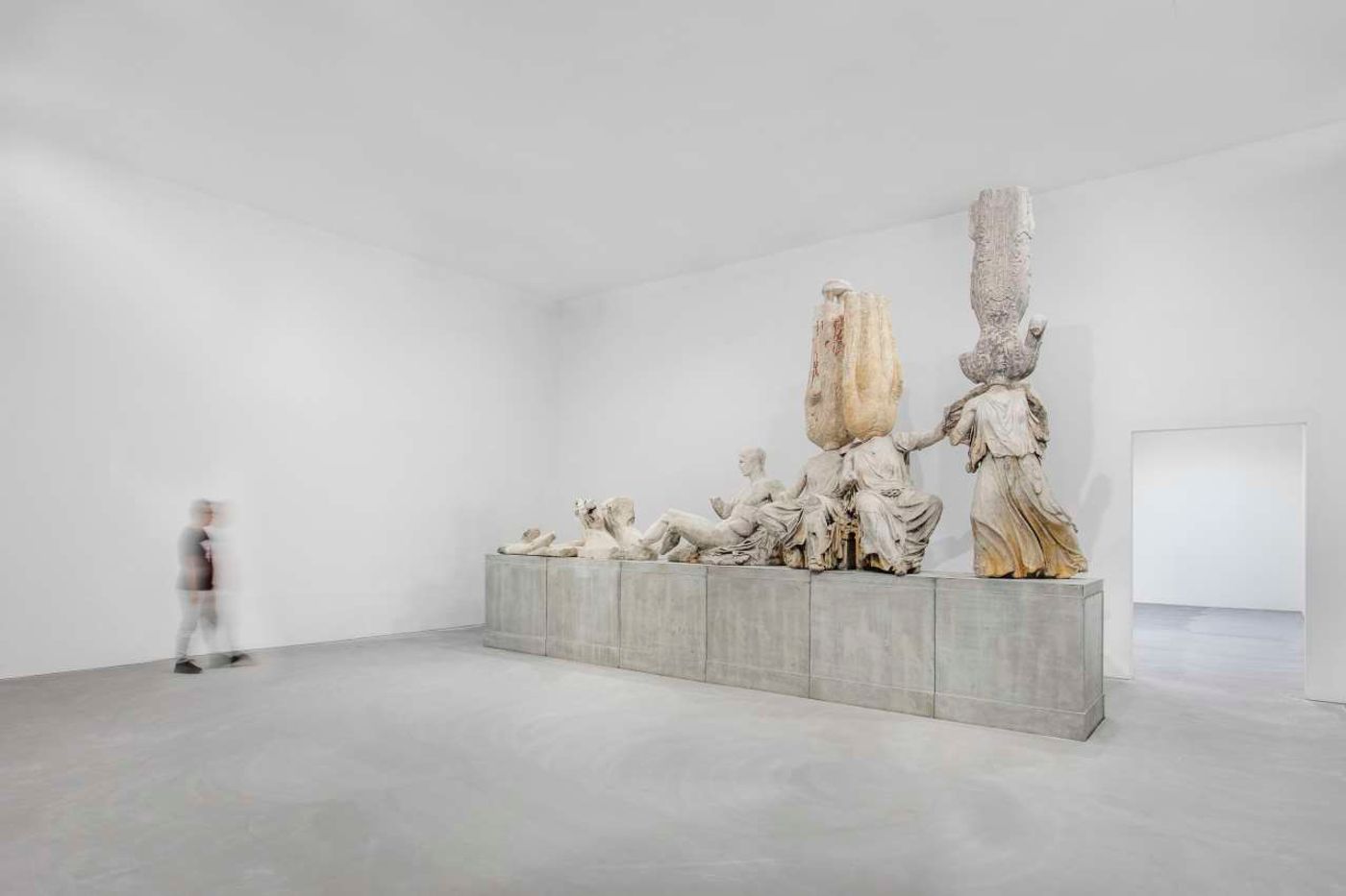 XU ZHEN®, Eternity – Northern Qi golden and painted Buddha, Tang Dynasty torso of standing Buddha from Quyang city, Northern Qi painted Bodhisattva, Tang Dynasty seated Buddha from Tianlongshan, Northern Qi painted Buddha, Tang Dynasty torso of a seated Buddha from Tianlonshan grotto No. 4, Parthenon East pediment, 2013-2014. Courtesy of the artist and MadeIn Company. XU ZHEN®, Eternity – Northern Qi golden and painted Buddha, Tang Dynasty torso of standing Buddha from Quyang city, Northern Qi painted Bodhisattva, Tang Dynasty seated Buddha from Tianlongshan, Northern Qi painted Buddha, Tang Dynasty torso of a seated Buddha from Tianlonshan grotto No. 4, Parthenon East pediment, 2013-2014. Courtesy of the artist and MadeIn Company.