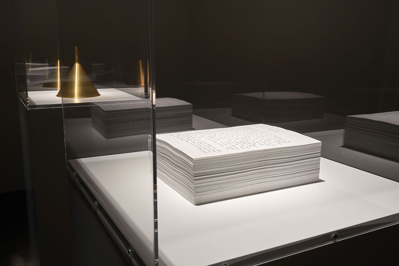 Installation view. Kris Martin, EXIT at S.M.A.K., Ghent, 2020. Photo by Dirk Pauwels.
Featured: Idiot, 2005. Ink on paper, 1494 pages.
Artist's statement: Like a monk, I copied The Idiot by F. Dostoevsky. In so doing, I replaced the name of the protagonist Myshkin with Martin and became the idiot myself. Installation view. Kris Martin, EXIT at S.M.A.K., Ghent, 2020. Photo by Dirk Pauwels.
Featured: Idiot, 2005. Ink on paper, 1494 pages.
Artist's statement: Like a monk, I copied The Idiot by F. Dostoevsky. In so doing, I replaced the name of the protagonist Myshkin with Martin and became the idiot myself.