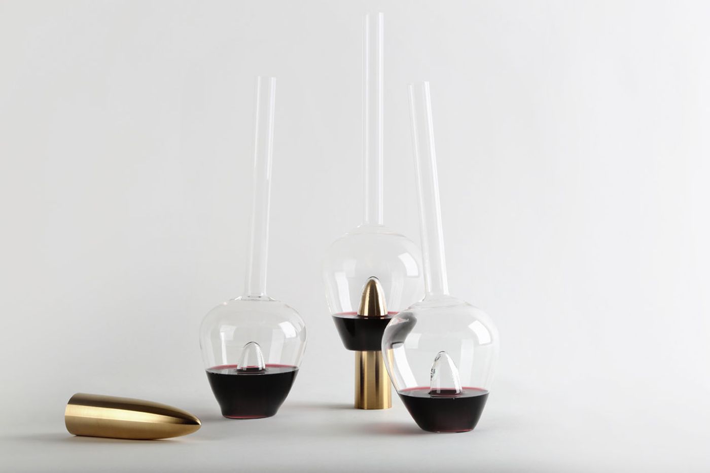 Plugged Carafes by Lebanese interior architect and product designer Richard Yasmine. Made of solid brushed brass and a very thin hand blown borosilicate glass. Photo by BizarreBeirut.
