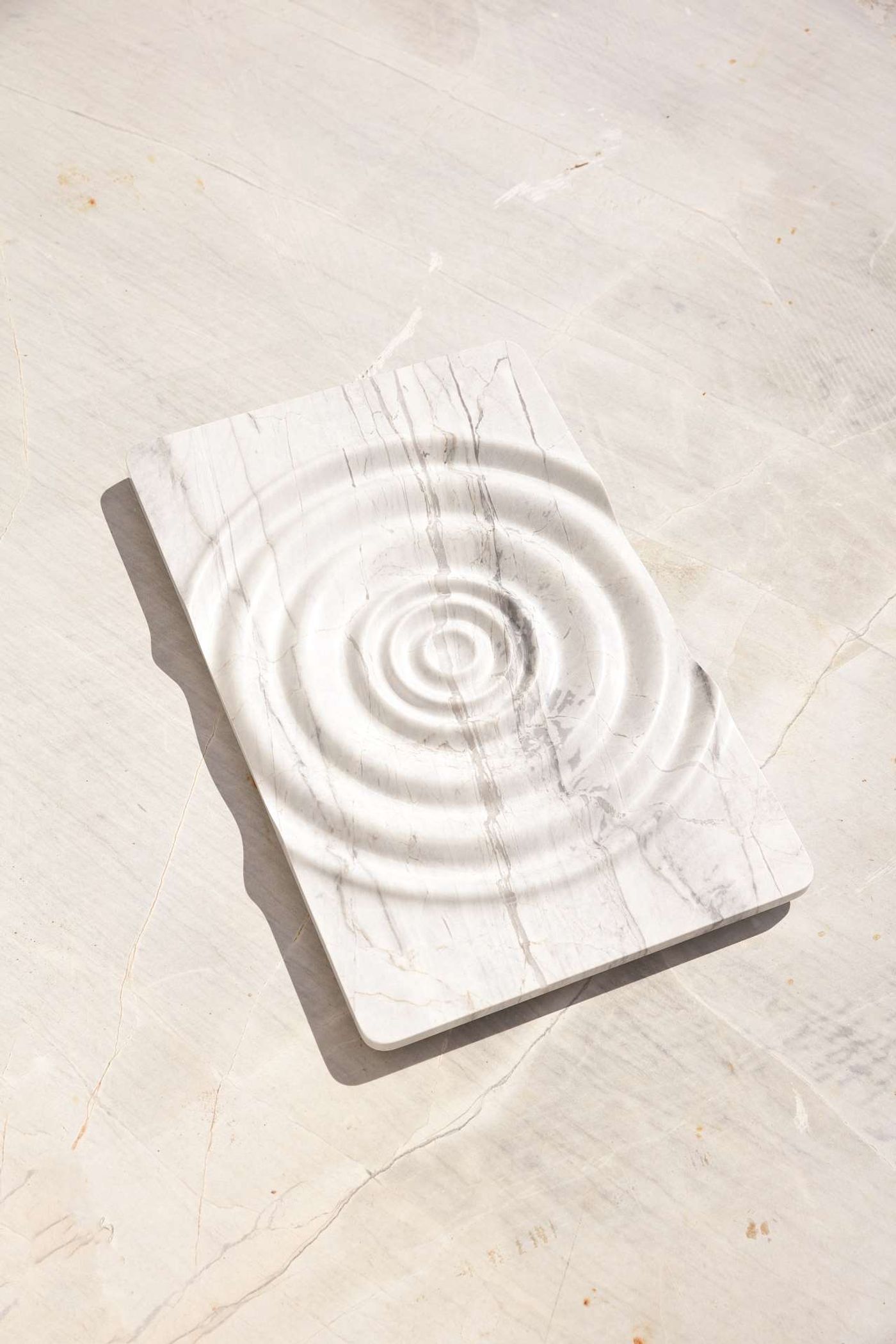 Lydn designed by Thomas Coward, Elba marble, 600 x 380 x 45mm. Part of New Volumes collection by Artedomus. Photo by Sean Fennessy. Lydn designed by Thomas Coward, Elba marble, 600 x 380 x 45mm. Part of New Volumes collection by Artedomus. Photo by Sean Fennessy.