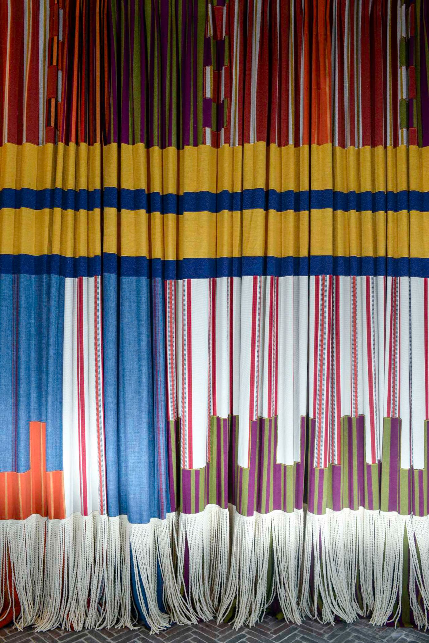 Heraldic-inspired curtains for a corporate headquarters in a Gothic revival manor. Featured in the book 'Fearless Living'. Photo © JPDEMEYER&CO. Heraldic-inspired curtains for a corporate headquarters in a Gothic revival manor. Featured in the book 'Fearless Living'. Photo © JPDEMEYER&CO.